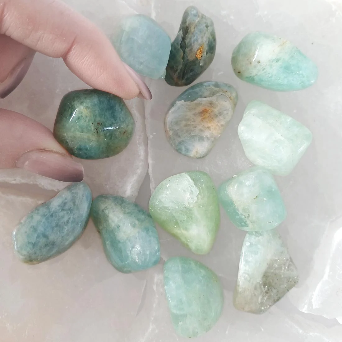 Aquamarine tumbled stone with soft blue tones. Supports calm communication, clarity, and emotional balance for meditation and daily use.