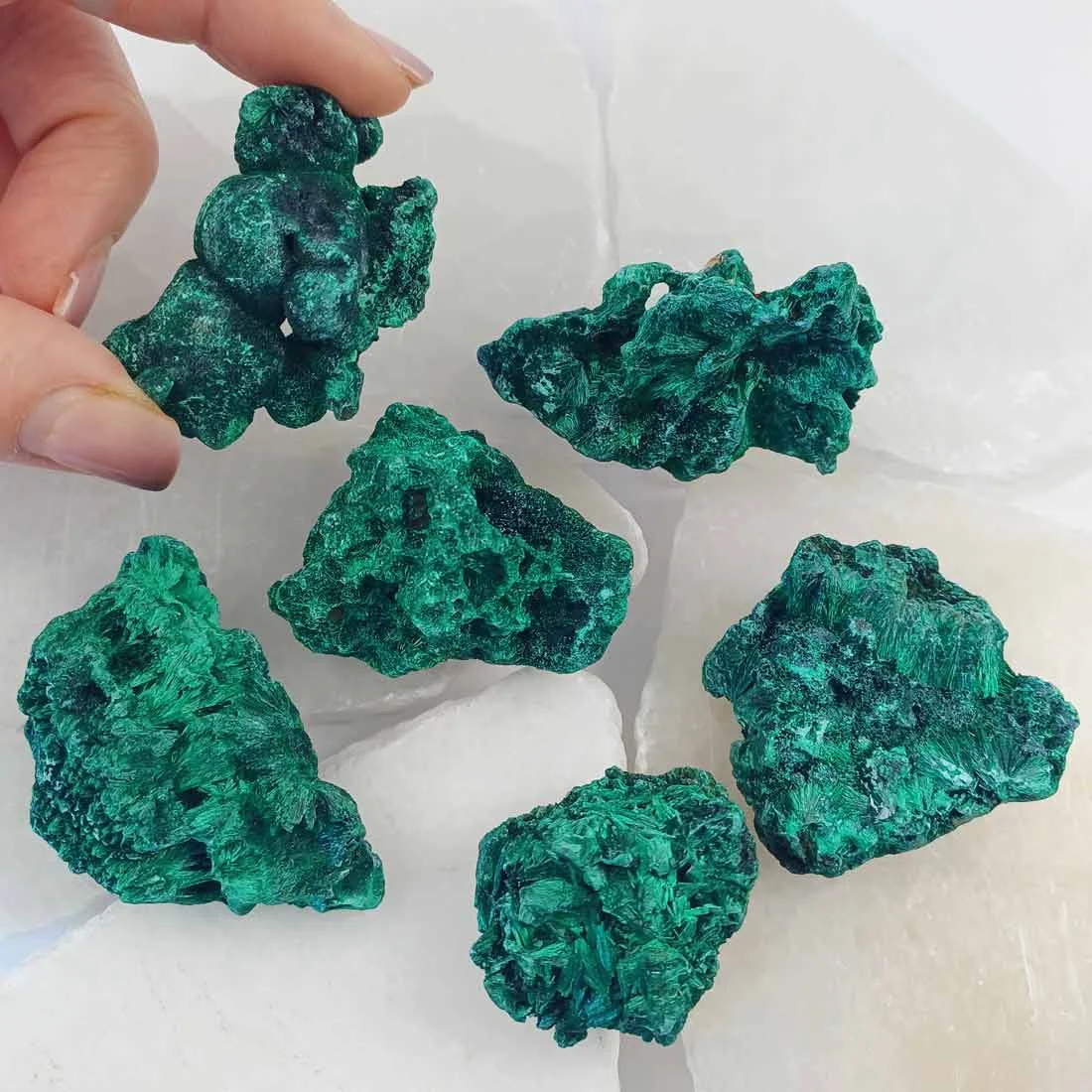 Fibrous malachite from Congo with deep green banding. A copper carbonate crystal formed in natural deposits, valued for its structure and geological origin.