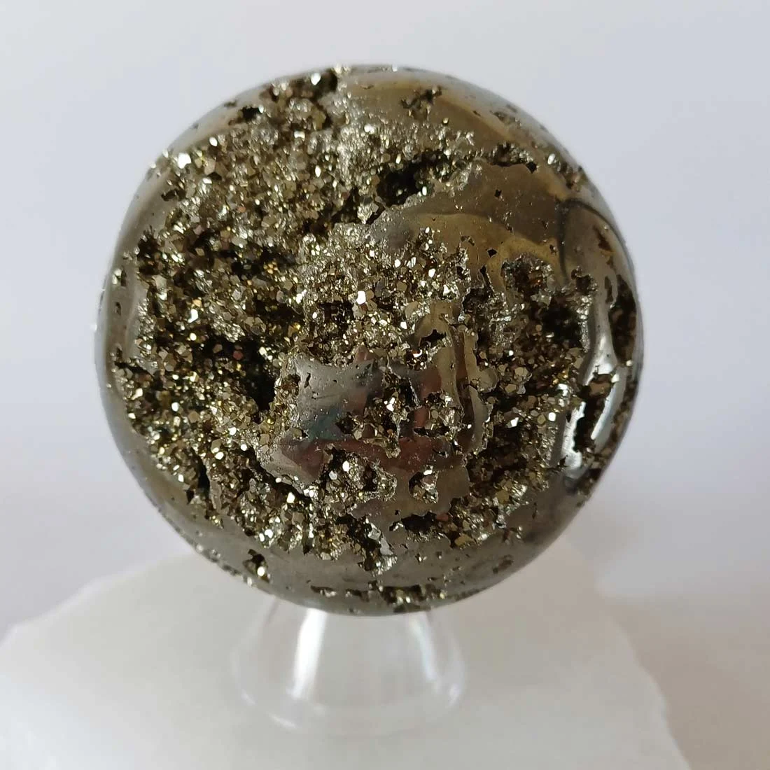 Natural polished Pyrite sphere for meditation, manifestation, and spiritual practice.