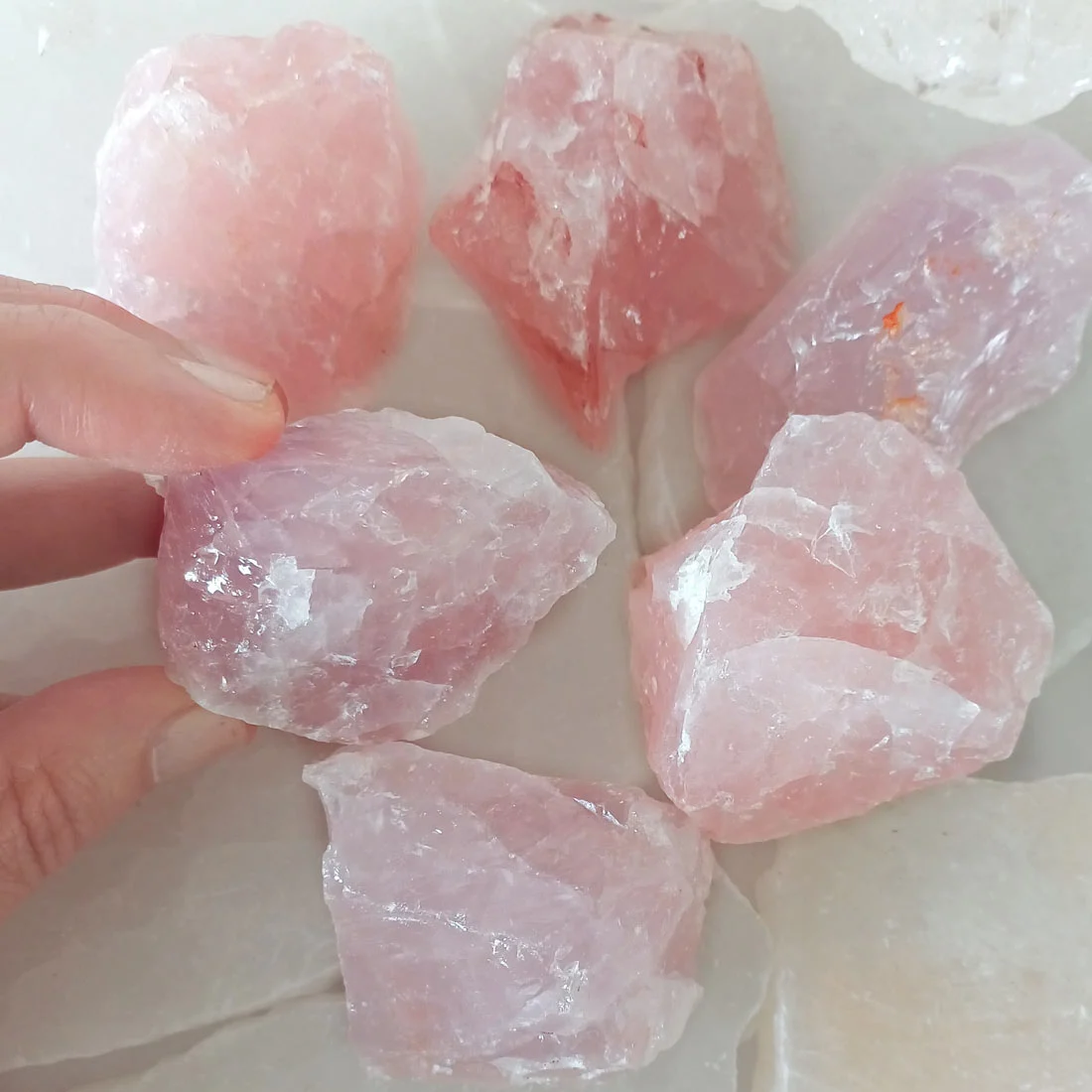 Natural rough Rose Quartz piece with a soft pink colour and uneven mineral surface. rose quartz cyprus