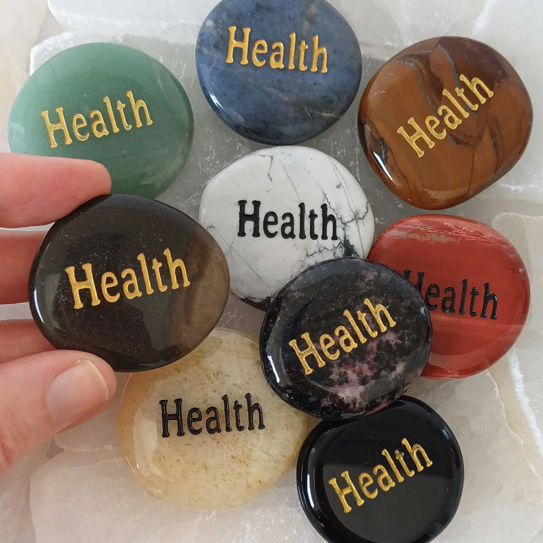 Assorted semiprecious Wish Stones engraved with the word HEALTH