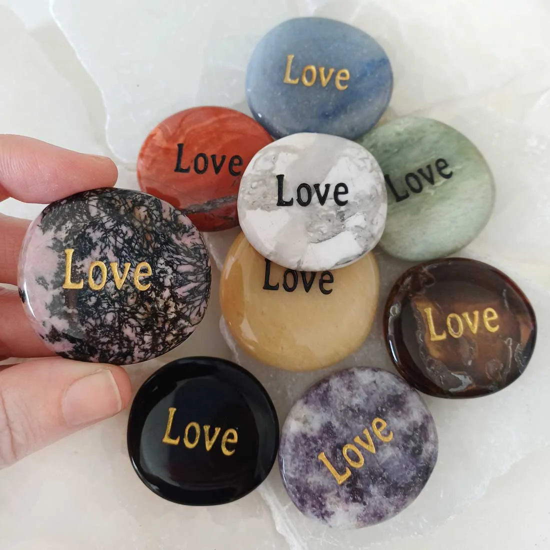 Assorted semiprecious Wish Stones engraved with the word LOVE