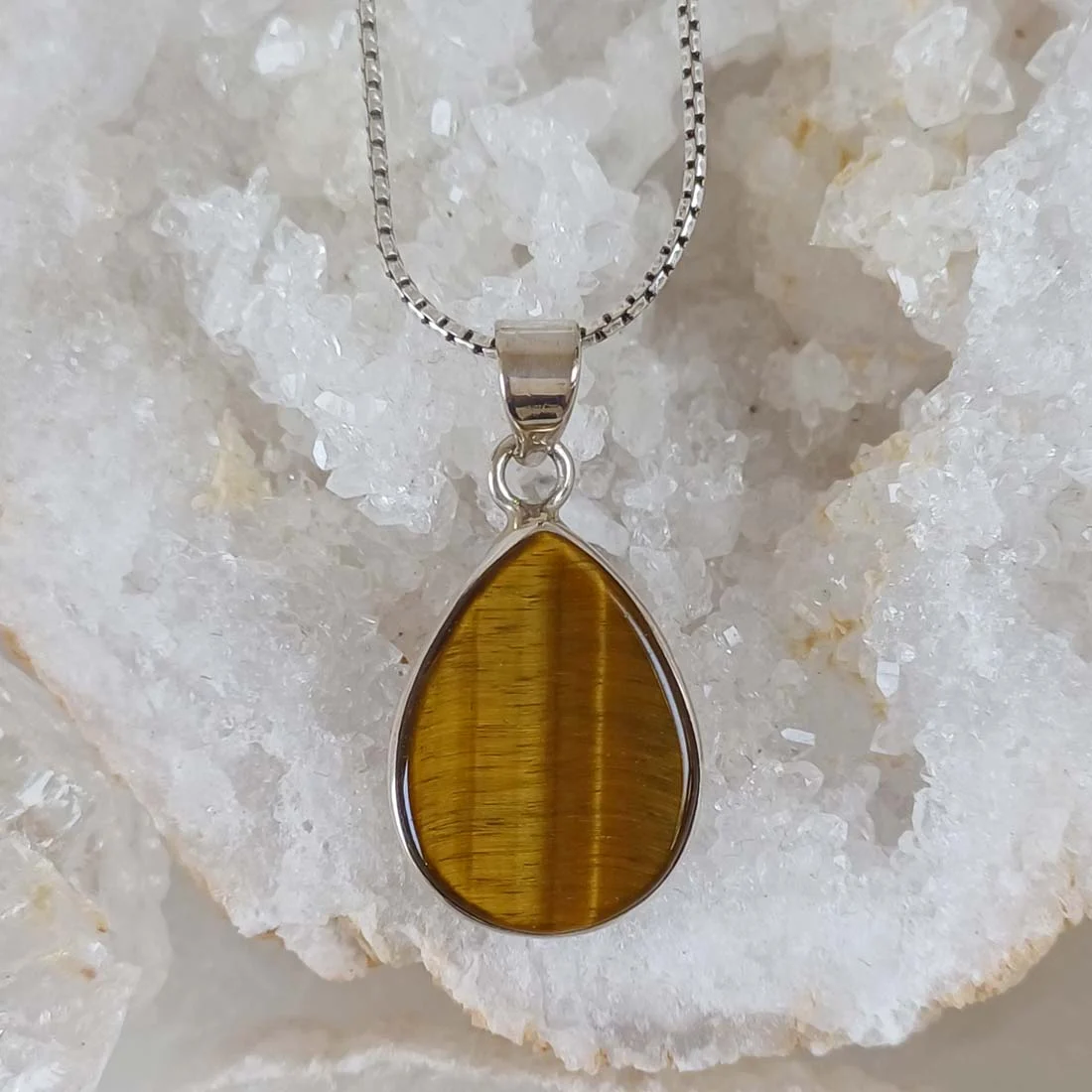 Tiger Eye drop shape pendant with a polished golden-brown Tiger Eye stone set in 925 Sterling Silver