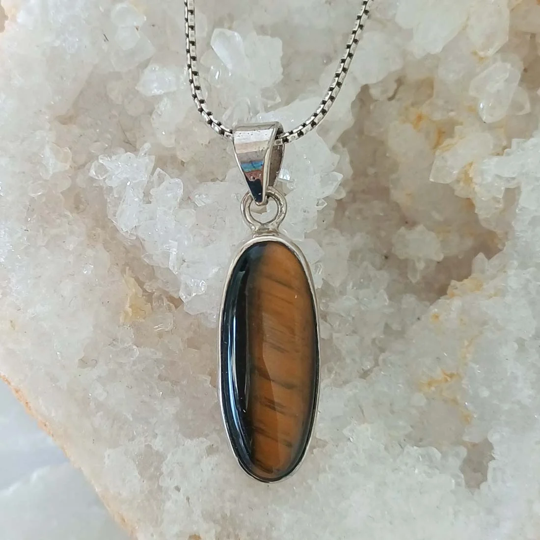 Tiger Eye long shape pendant with a polished golden-brown Tiger Eye stone set in 925 Sterling Silver