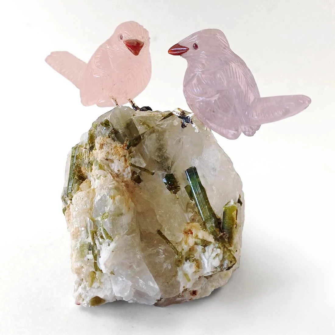 rose quartz and amethyst bird carvings on green tourmaline and quartz matrix by Peter Müller