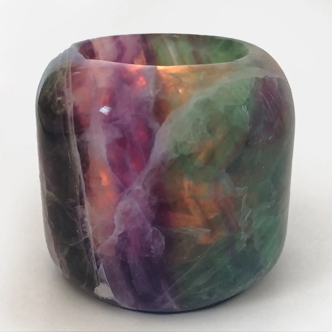 Polished Fluorite crystal candleholder with natural green and purple banding for tealight candles