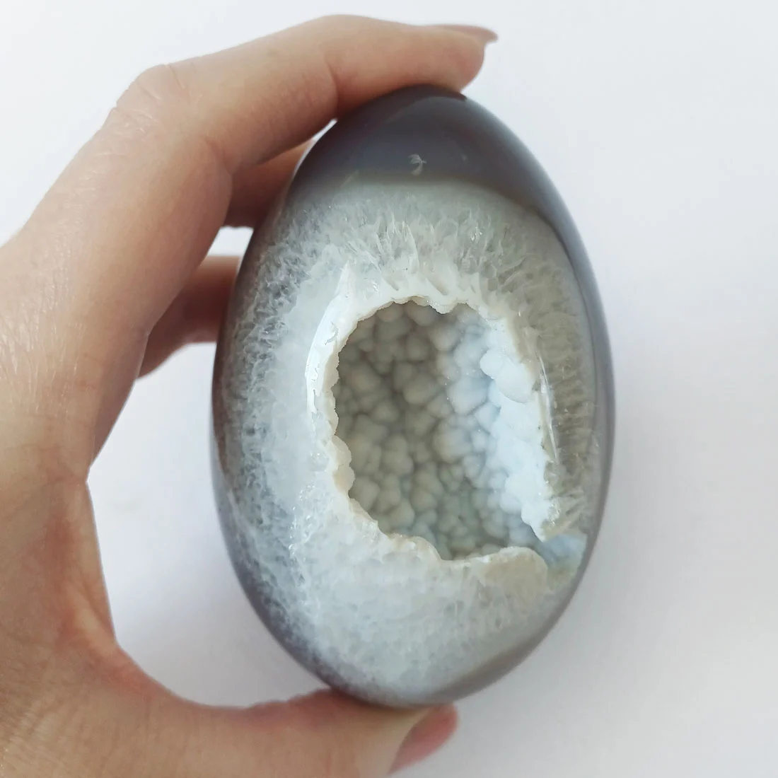 Polished Grey Agate Cosmic Egg with a natural botryoidal cavity formation