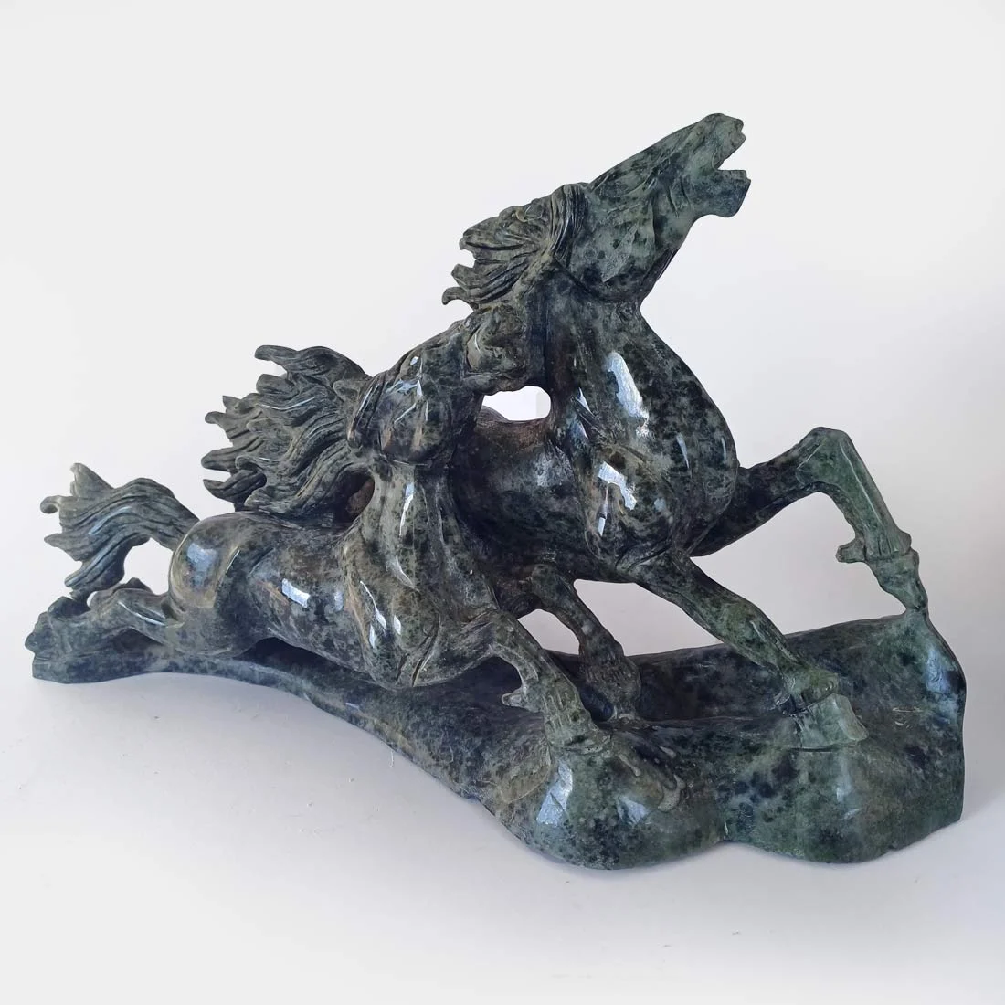 Natural Lushan Jade horse carving featuring two horses carved from polished green jade stone.