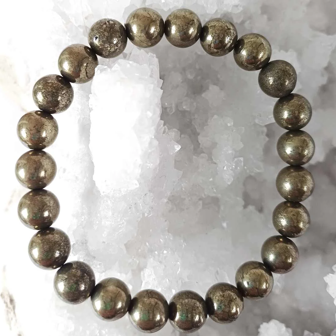 Bracelet made with natural Pyrite crystal beads in round shapes.