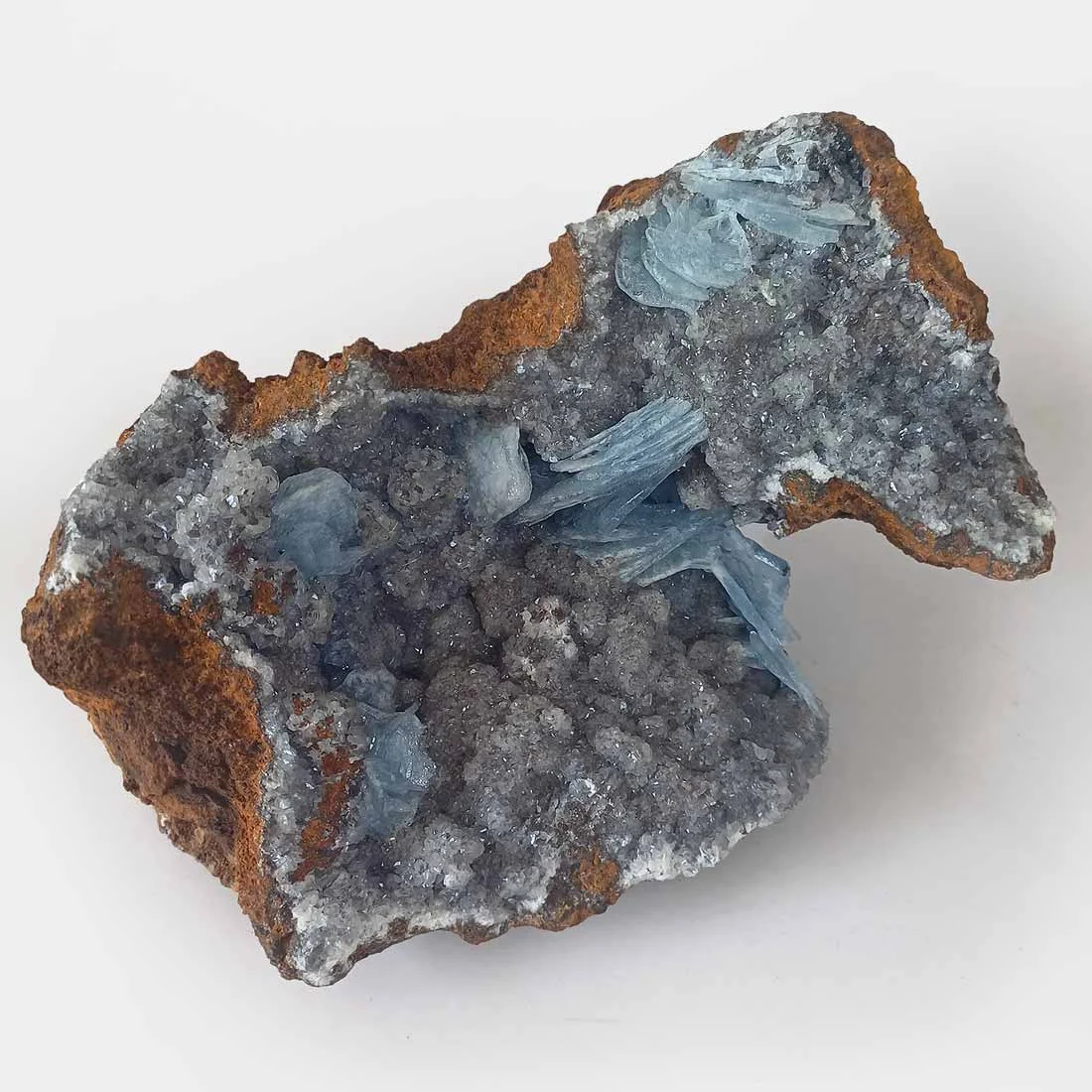 Blue Baryte crystals on quartz matrix with visible bladed crystal formations.