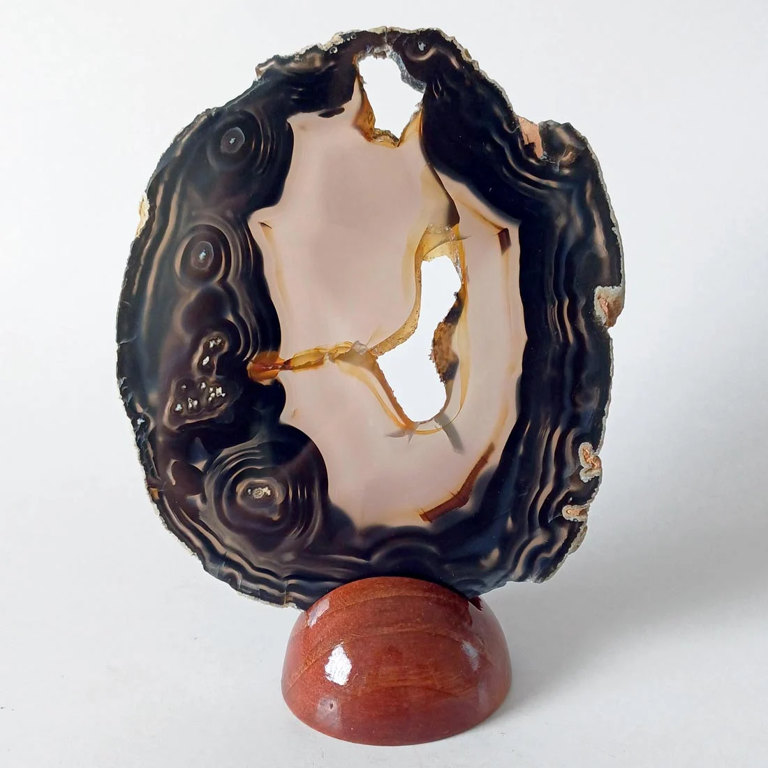 Natural agate slice rock on a removable wooden base