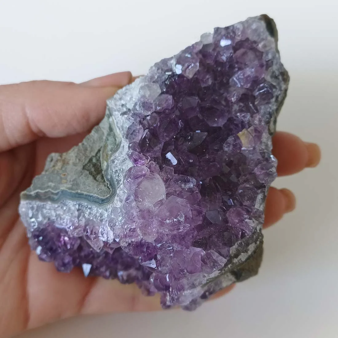 Natural Amethyst crystal cluster from Brazil with purple quartz crystal points