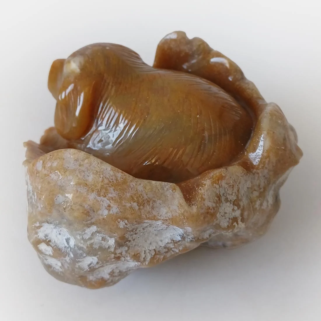 Chalcedony Agate Dog Carving symbolizing loyalty, companionship, and grounding energy.