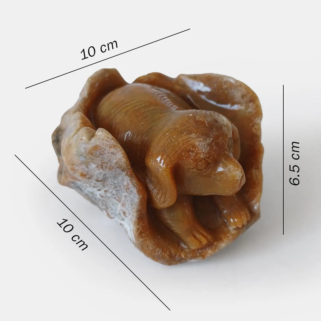 Chalcedony Agate Dog Carving symbolizing loyalty, companionship, and grounding energy.