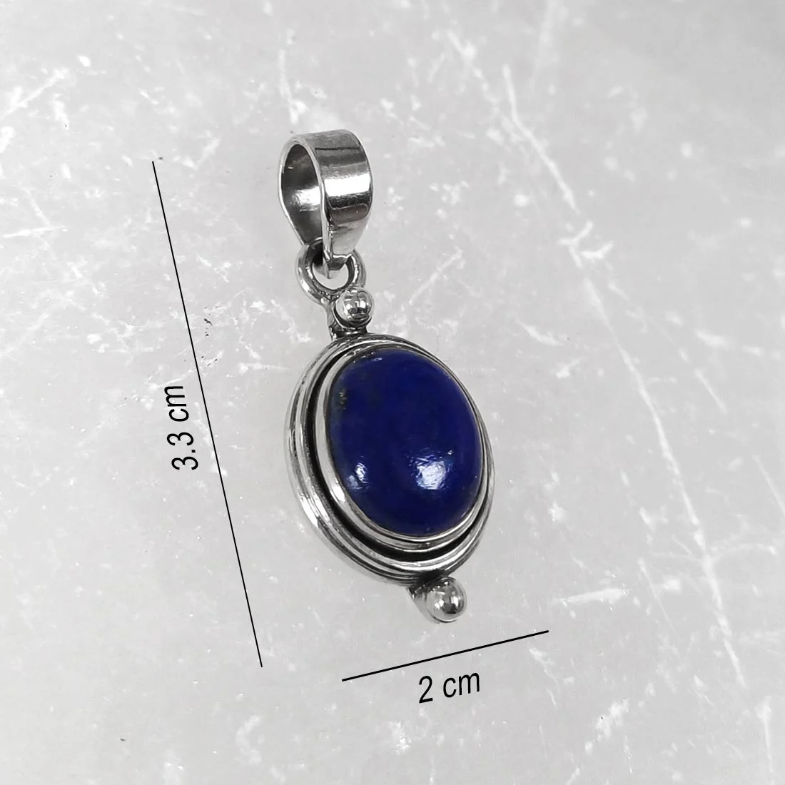 Oval lapis lazuli pendant set in 925 sterling silver with deep blue polished gemstone