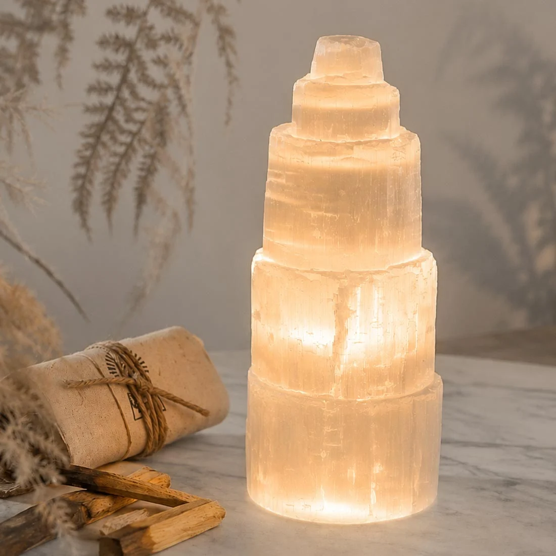 Natural Selenite Tower Lamp illuminated with a soft warm glow