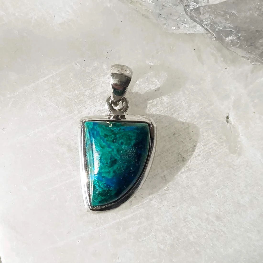 Irregular shape chrysocolla pendant with natural blue-green stone set in 925 sterling silver