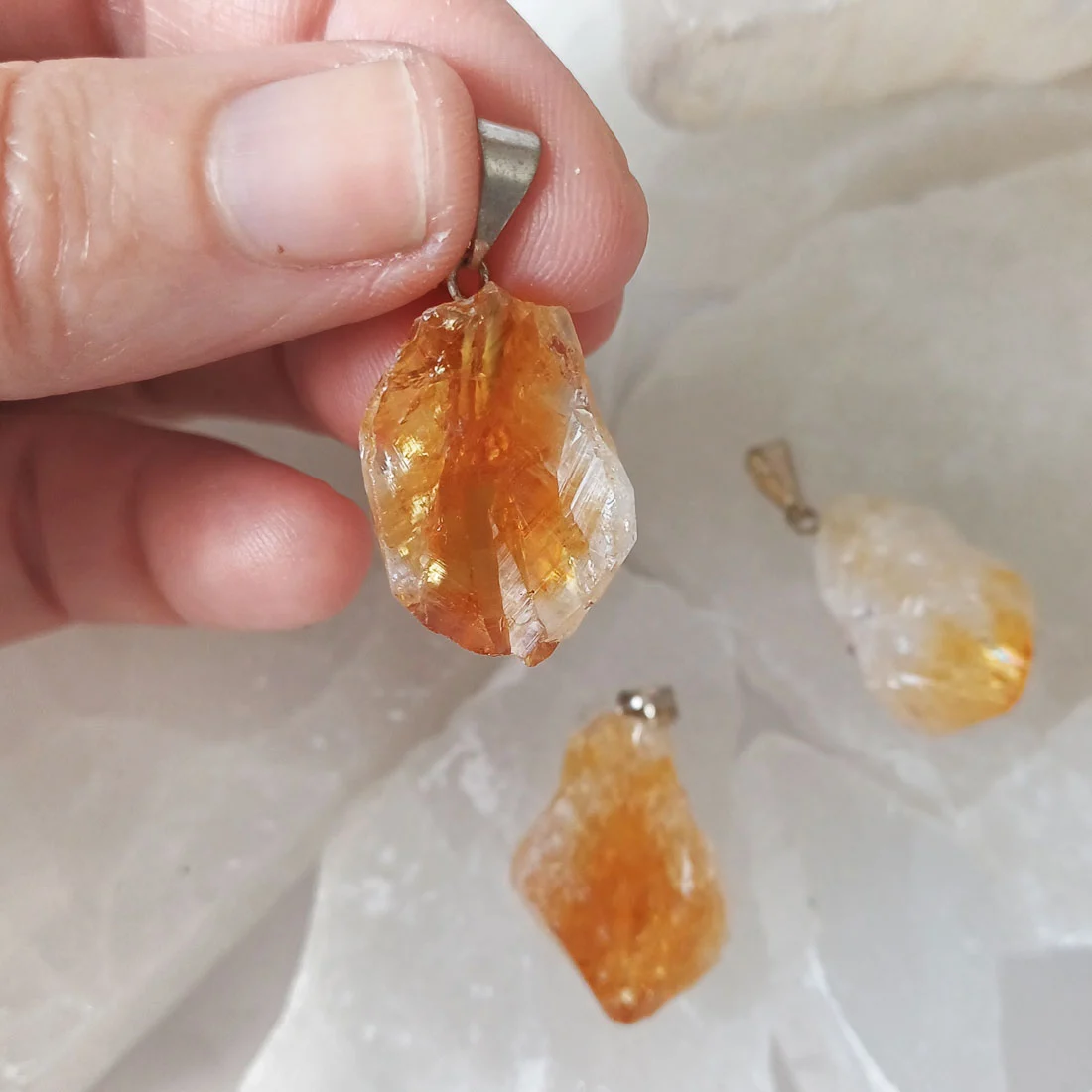 Natural Citrine rough point pendants with metallic hooks showing yellow and golden quartz crystals